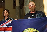 Sconey and Wayne Robert King holding the flag of Forgotten Australians South Australia Inc.