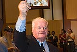 John Hennessey OAM, former child migrant, with photo of his late mother