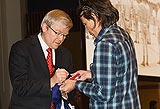 Prime Minister Kevin Rudd signing Sconey's flag